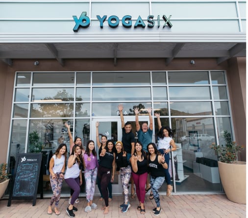 People in front of YogaSix